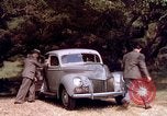 Image of People visiting a forest in their 1939 Ford car United States USA, 1939, second 36 stock footage video 65675051552