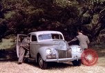 Image of People visiting a forest in their 1939 Ford car United States USA, 1939, second 37 stock footage video 65675051552