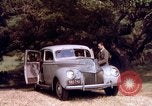 Image of People visiting a forest in their 1939 Ford car United States USA, 1939, second 38 stock footage video 65675051552