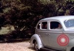 Image of People visiting a forest in their 1939 Ford car United States USA, 1939, second 49 stock footage video 65675051552