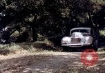 Image of People visiting a forest in their 1939 Ford car United States USA, 1939, second 61 stock footage video 65675051552
