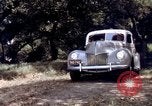 Image of People visiting a forest in their 1939 Ford car United States USA, 1939, second 62 stock footage video 65675051552