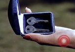 Image of Parents give daughter keys to a new Ford convertible United States USA, 1939, second 34 stock footage video 65675051553