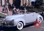 Image of Parents give daughter keys to a new Ford convertible United States USA, 1939, second 35 stock footage video 65675051553
