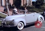 Image of Parents give daughter keys to a new Ford convertible United States USA, 1939, second 36 stock footage video 65675051553