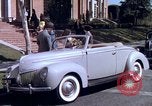 Image of Parents give daughter keys to a new Ford convertible United States USA, 1939, second 39 stock footage video 65675051553