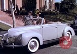 Image of Parents give daughter keys to a new Ford convertible United States USA, 1939, second 56 stock footage video 65675051553