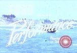 Image of motorboat pulling man and woman balanced on aquaplane United States USA, 1939, second 1 stock footage video 65675051556