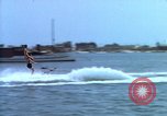 Image of motorboat pulling man and woman balanced on aquaplane United States USA, 1939, second 9 stock footage video 65675051556