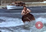 Image of motorboat pulling man and woman balanced on aquaplane United States USA, 1939, second 18 stock footage video 65675051556