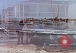 Image of motorboat pulling man and woman balanced on aquaplane United States USA, 1939, second 36 stock footage video 65675051556