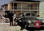 Image of motorboat pulling man and woman balanced on aquaplane United States USA, 1939, second 38 stock footage video 65675051556