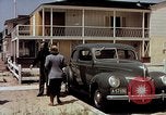 Image of motorboat pulling man and woman balanced on aquaplane United States USA, 1939, second 40 stock footage video 65675051556