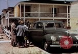 Image of motorboat pulling man and woman balanced on aquaplane United States USA, 1939, second 42 stock footage video 65675051556