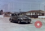 Image of motorboat pulling man and woman balanced on aquaplane United States USA, 1939, second 44 stock footage video 65675051556