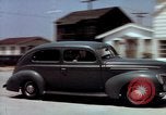 Image of motorboat pulling man and woman balanced on aquaplane United States USA, 1939, second 45 stock footage video 65675051556