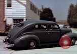 Image of motorboat pulling man and woman balanced on aquaplane United States USA, 1939, second 46 stock footage video 65675051556