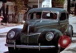 Image of motorboat pulling man and woman balanced on aquaplane United States USA, 1939, second 60 stock footage video 65675051556