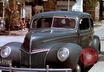 Image of motorboat pulling man and woman balanced on aquaplane United States USA, 1939, second 61 stock footage video 65675051556
