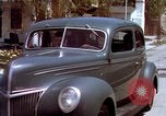 Image of motorboat pulling man and woman balanced on aquaplane United States USA, 1939, second 62 stock footage video 65675051556