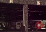 Image of buses in garage United States USA, 1937, second 6 stock footage video 65675051568