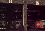 Image of buses in garage United States USA, 1937, second 7 stock footage video 65675051568