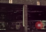 Image of buses in garage United States USA, 1937, second 8 stock footage video 65675051568