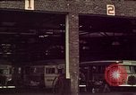 Image of buses in garage United States USA, 1937, second 9 stock footage video 65675051568