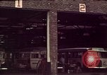 Image of buses in garage United States USA, 1937, second 10 stock footage video 65675051568