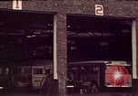 Image of buses in garage United States USA, 1937, second 11 stock footage video 65675051568