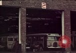 Image of buses in garage United States USA, 1937, second 13 stock footage video 65675051568
