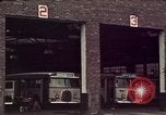 Image of buses in garage United States USA, 1937, second 17 stock footage video 65675051568