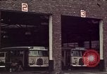 Image of buses in garage United States USA, 1937, second 18 stock footage video 65675051568