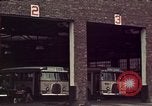 Image of buses in garage United States USA, 1937, second 19 stock footage video 65675051568