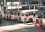 Image of buses in garage United States USA, 1937, second 22 stock footage video 65675051568
