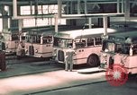 Image of buses in garage United States USA, 1937, second 24 stock footage video 65675051568