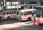 Image of buses in garage United States USA, 1937, second 26 stock footage video 65675051568