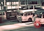 Image of buses in garage United States USA, 1937, second 28 stock footage video 65675051568