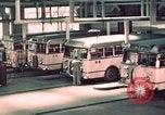 Image of buses in garage United States USA, 1937, second 36 stock footage video 65675051568