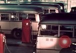 Image of buses in garage United States USA, 1937, second 40 stock footage video 65675051568