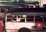 Image of buses in garage United States USA, 1937, second 41 stock footage video 65675051568