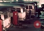 Image of buses in garage United States USA, 1937, second 46 stock footage video 65675051568