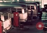 Image of buses in garage United States USA, 1937, second 47 stock footage video 65675051568