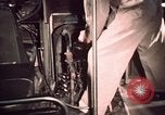 Image of buses in garage United States USA, 1937, second 56 stock footage video 65675051568