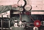 Image of buses in garage United States USA, 1937, second 5 stock footage video 65675051569