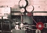 Image of buses in garage United States USA, 1937, second 10 stock footage video 65675051569