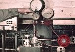 Image of buses in garage United States USA, 1937, second 17 stock footage video 65675051569