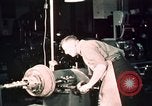 Image of buses in garage United States USA, 1937, second 56 stock footage video 65675051569