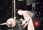 Image of buses in garage United States USA, 1937, second 57 stock footage video 65675051569