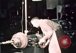 Image of buses in garage United States USA, 1937, second 58 stock footage video 65675051569